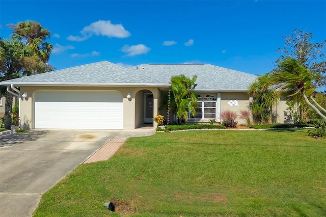 ranch-style house featuring a garage and a front lawn