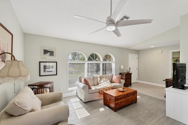 living room with ceiling fan and lofted ceiling