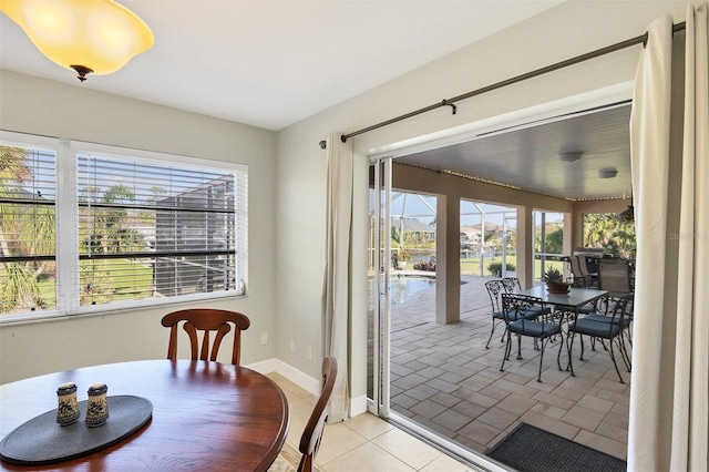 tiled dining area featuring a wealth of natural light