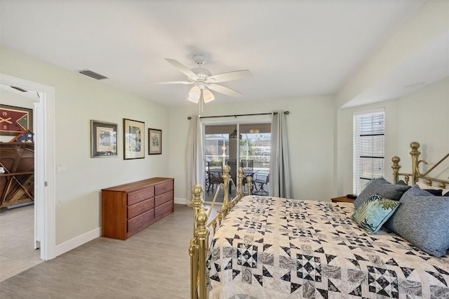 bedroom featuring light hardwood / wood-style floors, ceiling fan, access to outside, and multiple windows