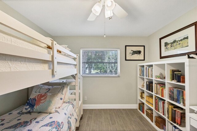 bedroom with ceiling fan and hardwood / wood-style floors