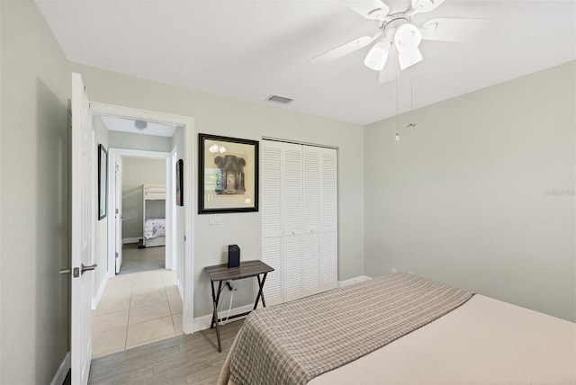 bedroom featuring ceiling fan and a closet