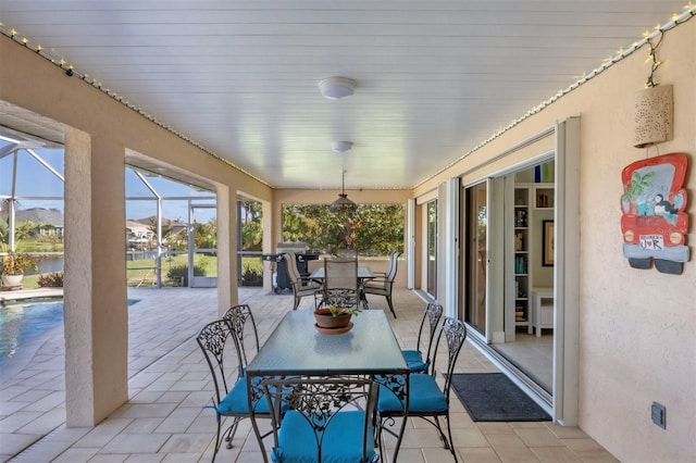 sunroom / solarium featuring a mountain view