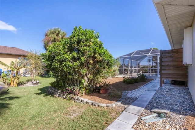 view of yard featuring a lanai