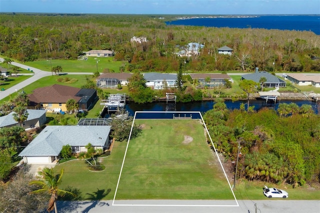 birds eye view of property with a water view