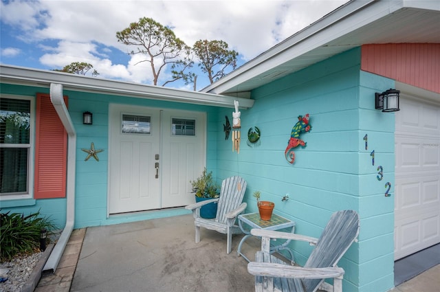 view of exterior entry with a garage