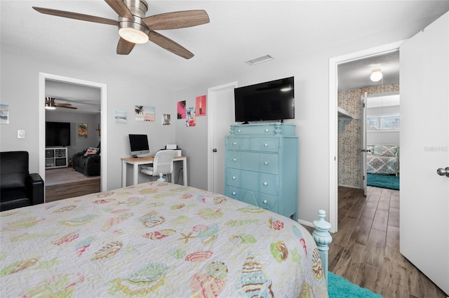 bedroom featuring hardwood / wood-style flooring and ceiling fan