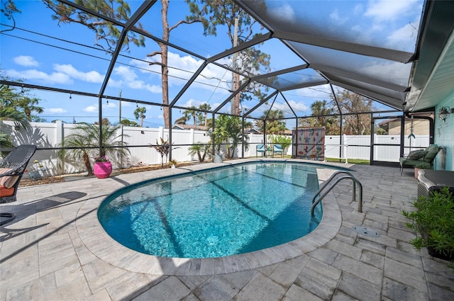 view of pool featuring a lanai and a patio