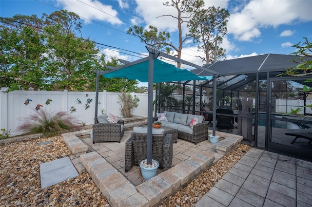 view of patio / terrace with an outdoor living space and a lanai