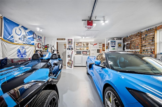 garage with washer and dryer and a garage door opener