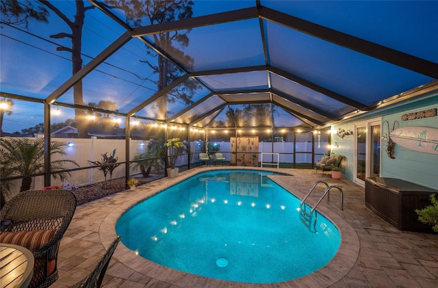 view of pool with a lanai and a patio area