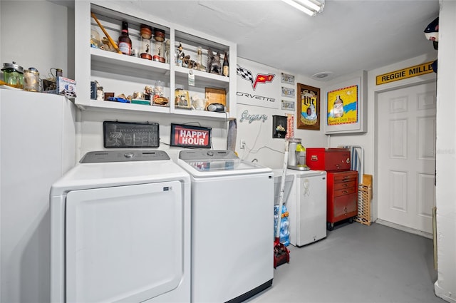 clothes washing area featuring independent washer and dryer