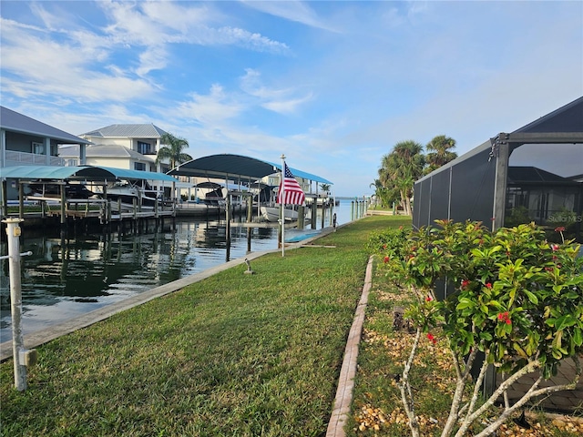 view of dock with a lawn, glass enclosure, and a water view