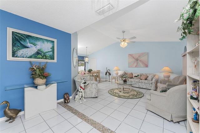 tiled living room featuring a textured ceiling, lofted ceiling, and ceiling fan