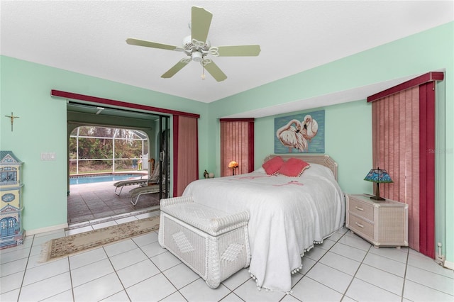 tiled bedroom with a textured ceiling and ceiling fan