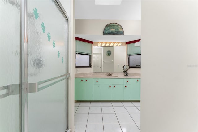 bathroom featuring vanity, tile patterned floors, and an enclosed shower