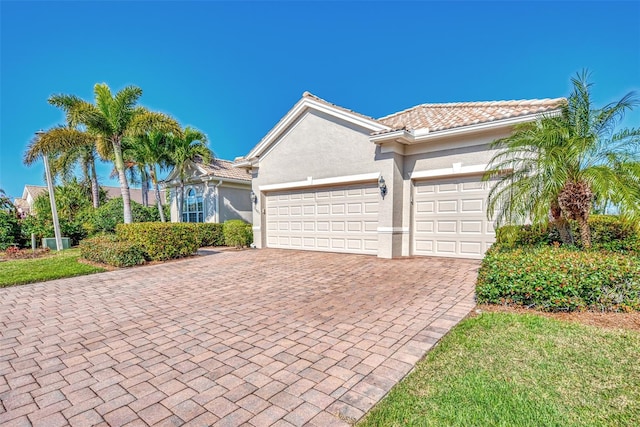 view of front of property with a garage