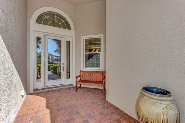 entrance to property featuring a patio area