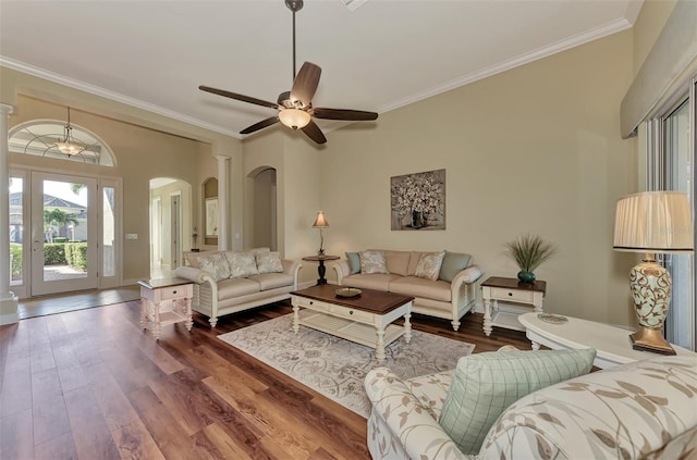 living room with ornamental molding, hardwood / wood-style floors, and ceiling fan