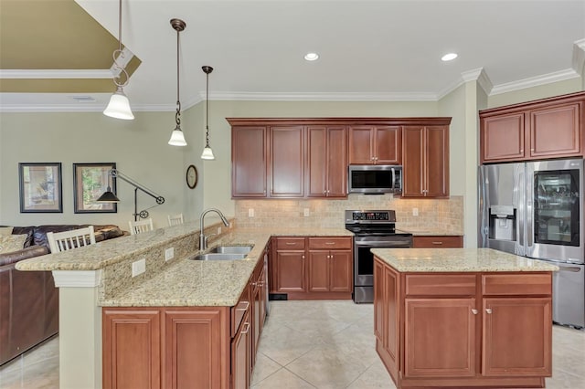 kitchen featuring sink, decorative light fixtures, ornamental molding, kitchen peninsula, and stainless steel appliances