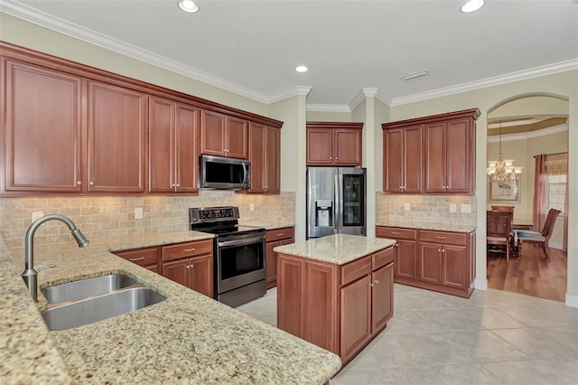 kitchen featuring sink, crown molding, stainless steel appliances, light stone countertops, and decorative backsplash