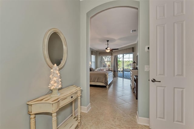 hall with light tile patterned flooring