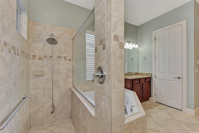 bathroom featuring tile patterned floors, vanity, and separate shower and tub