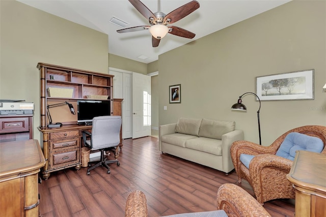 office with dark hardwood / wood-style floors and ceiling fan