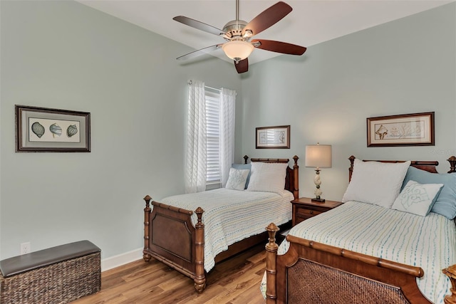 bedroom with light wood-type flooring and ceiling fan