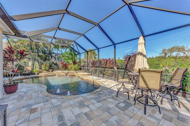 view of swimming pool with pool water feature, a lanai, and a patio