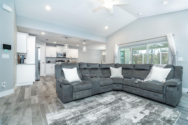 152 Apollo Dr, Rotonda West, FL 33947 - living area featuring light wood-type flooring, a ceiling fan, baseboards, lofted ceiling, and recessed lighting