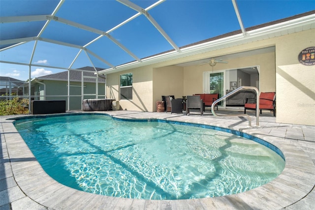 view of pool featuring a lanai, ceiling fan, and a patio area