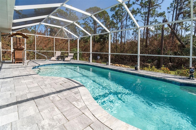 152 Apollo Dr, Rotonda West, FL 33947 - outdoor pool with a patio area and glass enclosure