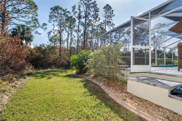 view of yard with a lanai