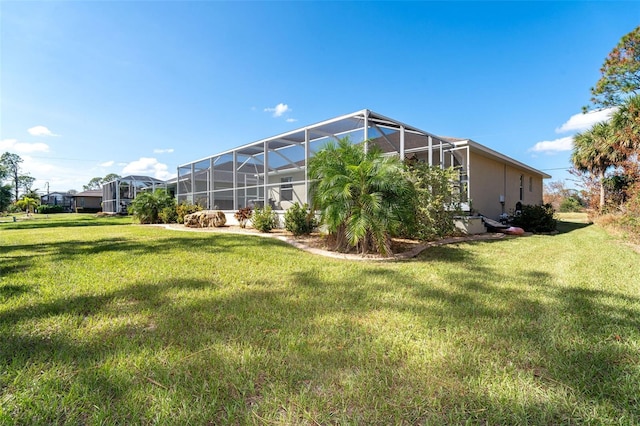 view of yard featuring glass enclosure