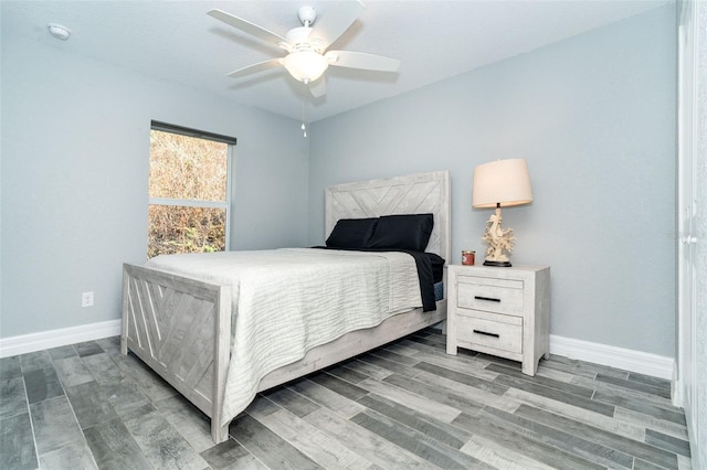 bedroom featuring wood-type flooring and ceiling fan