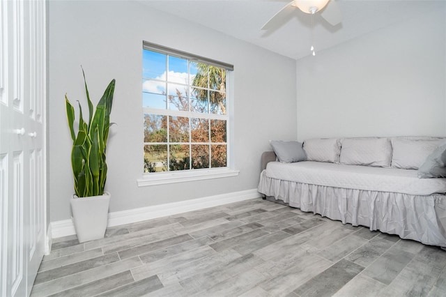 bedroom with ceiling fan and light hardwood / wood-style flooring