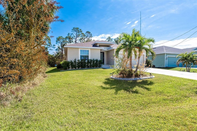 152 Apollo Dr, Rotonda West, FL 33947 - view of front facade with stucco siding, a garage, driveway, and a front yard