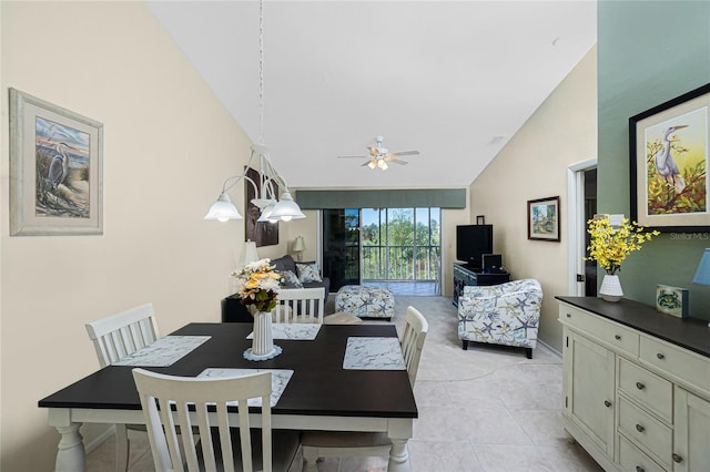 dining room with ceiling fan, high vaulted ceiling, and light tile patterned floors