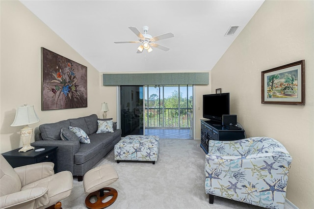 living room featuring ceiling fan, carpet, and vaulted ceiling