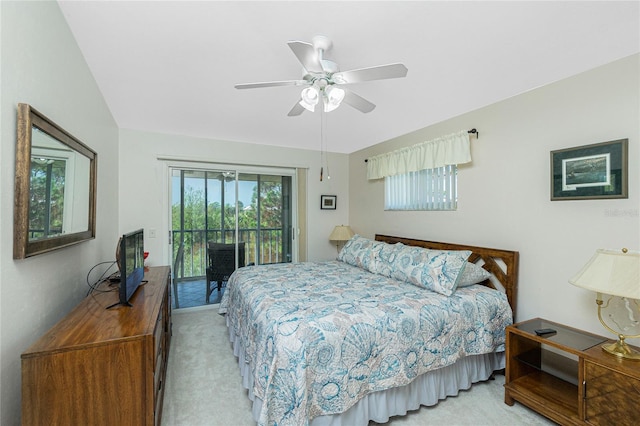 bedroom with access to exterior, light carpet, ceiling fan, and vaulted ceiling