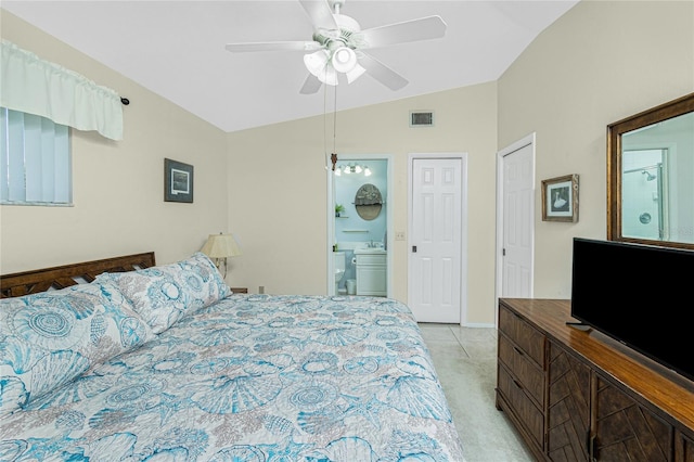 carpeted bedroom with connected bathroom, vaulted ceiling, and ceiling fan