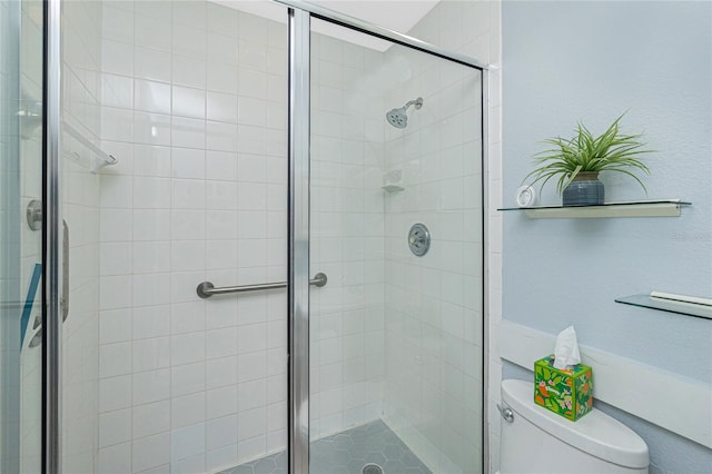 bathroom with walk in shower and toilet