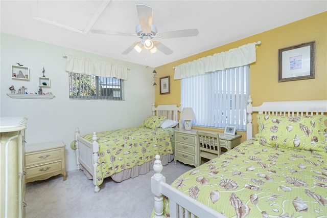 bedroom with ceiling fan and light colored carpet