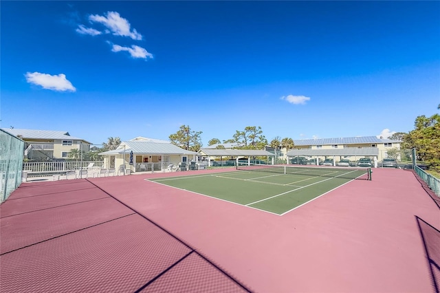 view of tennis court featuring basketball court