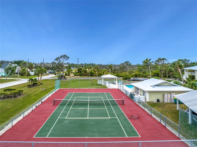 view of sport court with basketball hoop