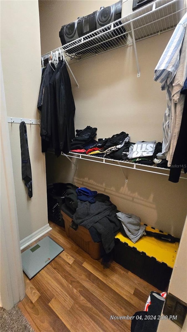 spacious closet featuring hardwood / wood-style floors