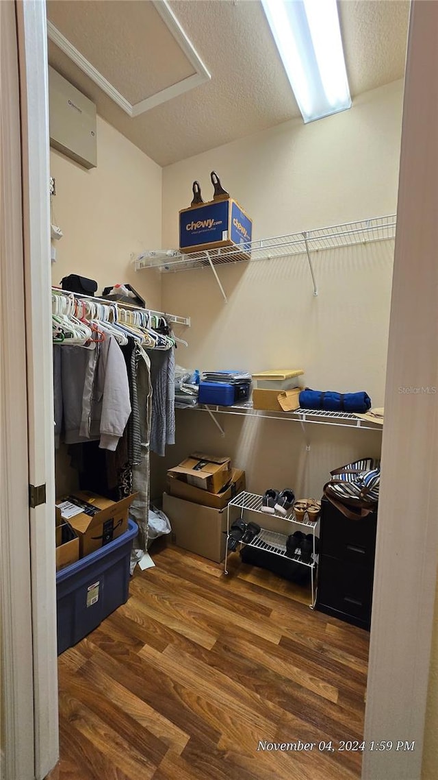 walk in closet featuring dark wood-type flooring