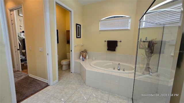 bathroom featuring toilet, plus walk in shower, and tile patterned flooring