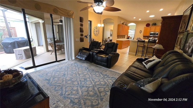 tiled living room featuring ceiling fan